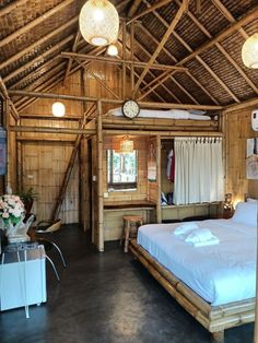 a bed sitting inside of a bedroom on top of a wooden floor