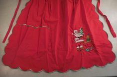 a red dress with santa claus on it