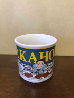 a coffee cup with a cartoon character on it