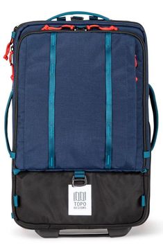 the back side of a blue suitcase with two straps and a tag on it's handle