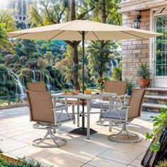 an outdoor dining set with umbrella and chairs