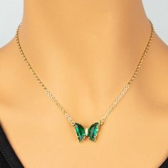 Shine in this playful acrylic butterfly necklace. Features transparent gem tone wings with crystal sparkle body. Measures 16" + 3" extension.Butterfly .5" x .75" Trendy Butterfly Necklaces For Party, Trendy Butterfly Jewelry For Parties, Trendy Butterfly-shaped Party Jewelry, Green Butterfly Charm Necklace, Butterfly Charm Necklace For Party, Crystal Butterfly Charm Necklace, Adjustable Butterfly Charm Necklace For Party, Gem Tones, Butterfly Pendant Necklace