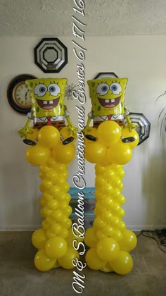 two yellow spongebobs are standing in front of each other with balloons attached to them