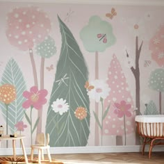 a child's room with pink and green wallpaper