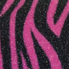 closeup of pink and black glittered zebra print on the side of a t - shirt