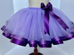 "This fabulous hand made lavander or (light purple) tutu skirt have two layers with purple color satin ribbon 1 1/2\" and purple glitter ribbon 7/8\" around the base to give extra puffiness with a beautiful bow to provide a finishing touch of glamour for your princess  Made to order! Great for birthdays and special occasions.  Note: please know you are purchasing a replica of the item show in the picture above, the tutu is handmade and no two tutus are exactly alike, color can varies depend of t Cute Purple Party Skirt, Purple Tulle Party Skirt, Fitted Lavender Skirt For Party, Cute Fitted Purple Skirt, Purple Tutu Skirt, Tutu Size Chart, Purple Tutu, Tutu Ballet, Girl Tutu Skirt