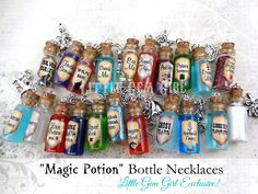 a group of small bottles filled with lots of different colored items on top of a table