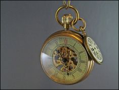 An exceptionally beautiful pocket watch.Beautiful as a chain watch over the shirt breast or as pocket watch in jeans to wear.Also the back shows the mechanical inner life.Since it is built according to the historical model of old watches, you have to pull it up manually once a day.The gait accuracy is astonishing.A suitable watch pendant underlines the Victorian charm.Of course you can get the watch also without a trailer or with a shorter pocket watch chain.**Material**  Brass, steel, trailer Steampunk Quartz Pocket Watch For Formal Occasions, Vintage Medallion Pocket Watch With Skeleton Dial, Gold Steampunk Pocket Watch With Locket, Vintage Skeleton Dial Pocket Watch For Formal Occasions, Vintage Round Pendant Pocket Watch For Formal Occasions, Victorian Skeleton Dial Pocket Watch As Gift, Vintage Skeleton Dial Pocket Watch As Gift, Mechanical Pocket Watch, Beautiful Business Card