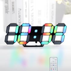 an alarm clock with multiple colored lights on it