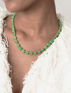 Make a gorgeous statement with this Bounkit Chrysoprase Riviere Necklace. This semi-precious gold-plated necklace will turn heads with its stunning, light green hue that's sure to take your breath away. Wear it and you'll be sure to be the envy of any crowd. MADE TO ORDER. SHIPPING IS 8-10 DAYS OR LESS FROM ORDER DATE. FINAL SALE. Chrysoprase 15.5" L + Extension Semi-precious Made in the USA SKU: BKT-3CHYR Green Single Strand Jewelry For Party, Single Strand Green Jewelry For Party, Green Emerald Gemstone Necklace For Party, Elegant Round Chrysoprase Necklaces, Green Chrysoprase Necklaces, Green Chrysoprase Round Necklace, Elegant Green Chrysoprase Necklace, Elegant Single Strand Chrysoprase Jewelry, Riviere Necklace