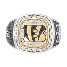 Take your fandom to new heights when you pick up this Cincinnati Bengals Championship ring. Sterling Silver & 10K Yellow Gold Showcases the Cincinnati Bengals' logo on top of the ring comprised of 1/4 ct tw of black and white diamonds one side has a football in a black rhodium finish and the other side has the NFL logo with black enamel and a black rhodium background Officially licensed NFL jewelry From the True Fans Fine Jewelry Collection Nfl Jewelry, Bengals Logo, Gold Layered Bracelets, Neil Lane Engagement Rings, Pearl Diamond Jewelry, Cross Jewelry Necklace, Fan Jewelry, Bezel Engagement Ring, Championship Rings