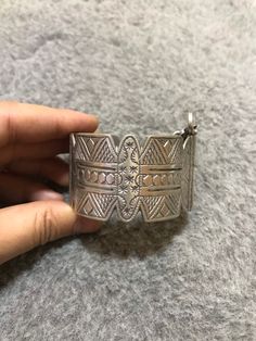 A beautiful old Berber silver bracelet from Morocco. The surface of the bangle has been finely hand-etched with a design combining lines, and the surface as well as interior have both obtained a rich patina from wear and usage. It opens and closes with a pin. Inner diameter : 5,8cm Width : 3,7cm Weight : 83,8g Bohemian Sterling Silver Bracelet For Ceremonial Occasions, Artisan Silver Bracelets With Intricate Design, Bohemian Etched Cuff Bracelet For Ceremonial Occasions, Artisan Bangle Bracelet With Intricate Design, Bohemian Sterling Silver Bangle Bracelet, Bohemian Stamped Sterling Silver Bracelet, Bohemian Etched Sterling Silver Bracelet Gift, Etched Bracelet Jewelry For Festivals, Bohemian Engraved Sterling Silver Bracelet For Ceremonial Use