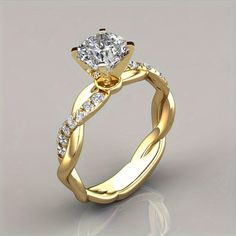 a yellow gold engagement ring with a twisted band and a round cut diamond in the center