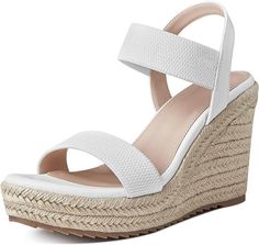 a woman's white wedged sandal with two straps and an ankle strap