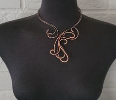 Handcrafted antique copper open necklace with bare copper wire. Hammered, tarnished, polished, and covered with a clear coating to protect the necklace from future discoloration.  If you need to clean your copper jewelry, please clean it by using warm water, and soap. Simply rub the mixture lightly and rinse with clean water and dry with a soft cloth.  Only one available. The pictured jewelry item in this listing is the actual piece you will receive. There are no Photoshop enhancements.  Thank you very much for looking! Happy shopping! Hand Forged Brown Metal Necklace, Handmade Rose Gold Copper Necklace, Handmade Copper Wire Gold Necklace, Hand Forged Copper Necklace In Rose Gold, Hand Forged Rose Gold Copper Necklace, Adjustable Bronze Copper Necklace, Adjustable Hand Forged Copper Necklace, Soldered Copper Rose Gold Necklace, Hand Forged Copper Wire Necklace With Adjustable Fit