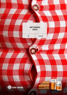 a red and white checkered shirt with the label not enough space