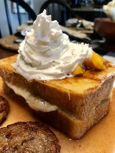 a piece of toast with whipped cream on top