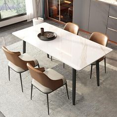 a dining room table with chairs around it