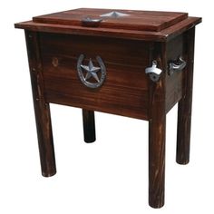 a small wooden table with a star on the top and two metal knobs at the bottom