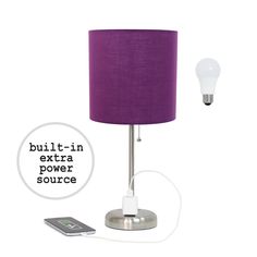 a lamp with a purple shade next to a cell phone and an extra power source