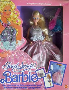 the barbie doll is in its pink box