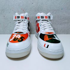 Elevate your sneaker game with these one-of-a-kind, hand-painted Air Force 1s! Show your love for the Atlantic Coast Conference with a custom design featuring your favorite NCAA team. Each pair is meticulously crafted with high-quality paints, ensuring a vibrant and long-lasting finish. Customize your sneakers: Color Scheme:Default: I'll use a balance of white and your school's primary colors.Customize: If you prefer more or less of your school colors, please let me know. Design Elements:Standar Painted Air Force 1, Mid Sneakers, Air Force 1s, Air Force 1 Mid, Sneaker Games, School Colors, The Atlantic, Air Force 1, Color Scheme