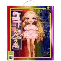 a doll with blonde hair and blue eyes in a pink dress standing next to a box