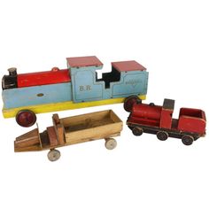 three wooden toys including a toy train and car