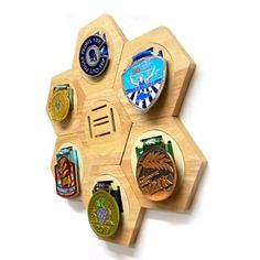 a hexagonal wooden board with six medals mounted on it's center piece