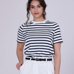 A simple and comfortable cut, this t-shirt features horizontal stripes and a round neck. A great classic in any wardrobe, the sailor style is timeless and can be worn for casual occasions on vacation or be paired with a blazer for an office outfit. Main material: 100% cotton. Washing temperature 30 ° maximum in delicate cycle. Low ironing temperature / do not bleach. Do not dry in drum. Striped T Shirts Women, Striped T Shirt Outfit, Black White Striped Shirt Outfit, White Contrast Stripes T-shirt For Summer, Stripe Shirt Outfit, Black And White Striped Shirt Outfit, Striped Shirt Outfit, Black T-shirt With Contrast Stripes For Summer, Cheap Cotton T-shirt With Three Stripes Branding