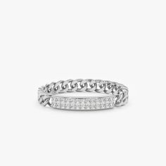 a white gold ring with diamonds on the side and an intertwined band, set in 18k white gold