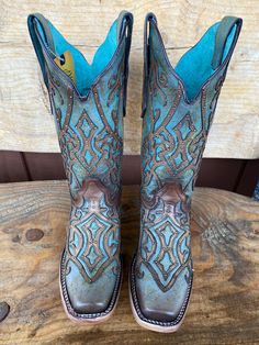 This Corral Women's Western Boot in rich Brown with its fancy turquoise leaves us speechless. Its stunning good looks include a trendy square toe. This boot is everything a cowgirl could want for that special boot in her collection. Turquoise and brown leather Brown overlay Embellished with brass studs Leather lining Leather outsole Double stitch welt Goodyear welt construction Walking heel Square toe 1.5" heel 12" Shaft 15.5" Calf Circumference ﻿Measurements for this boot were taken from a size Brown Overlay, Square Toe Cowgirl Boots, Cowgirl Boots Square Toed, Fish Embroidery, Embroidery Square, Square Toe Western Boots, Turquoise And Brown, Western Store, Country Kids