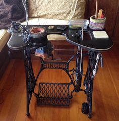 a sewing machine sitting on top of a wooden floor