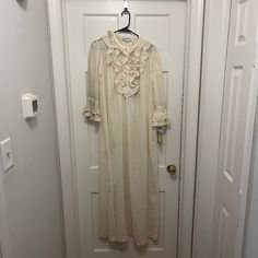 -Has Original Tag -Slightly Discolored For Age -Ruffled Trim In The Front With 4 Buttons White Ruffled Dress For Home, Feminine Long Sleeve Sleepwear With Ruffles, Feminine Long Sleeve Ruffled Sleepwear, Feminine Ruffled Nightgown For Sleep, Elegant Ruffled Sleepwear, Vintage Nightgown With Ruffles For Loungewear, Vintage Ruffled Nightgown For Loungewear, Feminine Ruffled Sleepwear, Spring Nightgown With Ruffles For Bedtime