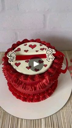 a red and white cake with hearts on it