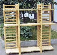 two wooden shelves sitting next to each other on the sidewalk