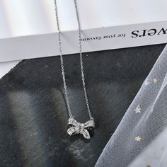 Silver Bow Pendant Necklace ,Simple Stylish Dainty Necklace Dainty necklace for women with bow pendant, looks more elegant and tiny, female must have Can be worn every day for a casual look and paired with the matching necklace pendant to complete your outfit. Suitable for mother or girlfriend, they will be very surprised and happy when they receive it bow necklace length:15.74''+2.55''(extension chain) Thank you so much for your support, if any doubt, please feel free to let me know Silver Necklaces For Mother's Day Party, Dainty Silver Rhinestone Necklace For Party, Cubic Zirconia Necklaces For Mother's Day Party, Mother's Day Party Necklaces With Cubic Zirconia, Mother's Day Party Necklace With Cubic Zirconia, Rhinestone Necklace For Anniversary, Crystal Rhinestone Pendant Necklace Gift, Crystal Pendant Rhinestone Necklace As Gift, Crystal Rhinestone Necklace As Gift