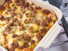 a casserole dish with sausage and cheese