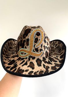 Leopard print cowboy hat Be the best dressed at the rodeo Size: One size fits all Personalised with you chosen initial  A Hen party, Festival or fancy dress party necessity  The perfect party essential Cowgirl chic!  Order and let me know the initial required FREE UK DELIVERY - Dispatched by 1st Class Royal Mail Western Style Cap For Country Events, Country Style Costume Hat For Events, One Size Top Hat For Rodeo And Kentucky Derby, Western Hats For Halloween And Western-themed Events, Western Style Hat For Rodeo, Western Style Hats For Halloween And Western-themed Events, Western Curved Brim Costume Hat For Parties, Western Costume Hat For Halloween, Western Style Halloween Costume Hats With Curved Brim