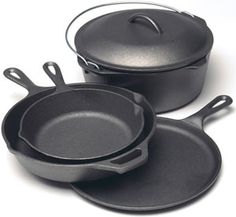 three black pots and pans on a white background