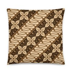 a decorative pillow with brown and white designs