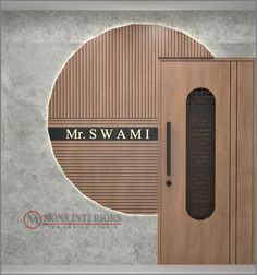 the door is made out of wood and has a name on it that reads mr swami