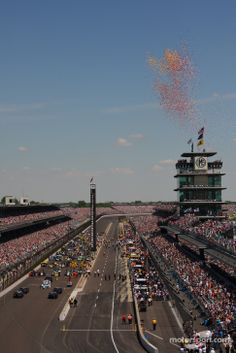 an aerial view of a race track with lots of spectators