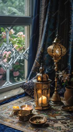 a table topped with candles next to a window