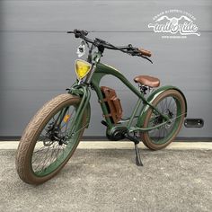 a green bicycle parked in front of a garage door