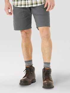 A SUMMER WARDROBE MADE FOR FUNCTION Those hot summer days can make the workday feel even longer than usual. Get your work wardrobe updated for the warm weather ahead with the Wrangler® RIGGS WORKWEAR® work shorts. Comfortable, practical, and built to last, these men's shorts feature just enough stretch to keep you moving comfortably, a gusseted crotch for maximum mobility, front patch pockets, and CORDURA® fabric-lined back pockets. These function-first shorts are perfect for a summer wardrobe t Summer Bottoms With Pockets For Outdoor Work, Cotton Shorts For Outdoor Work, Casual Shorts For Outdoor Work, Casual Bottoms With Hip Pockets For Outdoor Work, Wrangler Shorts, Work Shorts, Wardrobe Update, Men's Apparel, Work Wardrobe