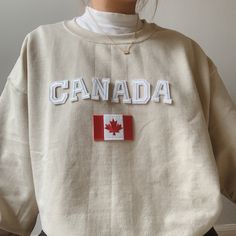 This cute Canada Sweatshirt is the perfect gift to Canada lovers! - Material is super soft and comfy! ♡ - All our sweatshirts run a Unisex fit. They are naturally oversized, but if you like a more baggy look, we recommend sizing up. - These letters are iron-on patched and is heat pressed, not embroidered. - Please note that crewneck brand used may vary depending on what our supplier has, therefore sizes and dimensions might also vary by a little bit. (Hanes, Gildan, Jerzees) Please be mindful th Canada Sweatshirt, Canada Clothing, Outdoorsy Outfits, Trendy Things, Canada Shirt, Canada Clothes, Cool Shirt Designs, Brown Sweatshirt, Diy Sweatshirt