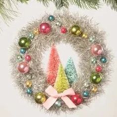 Brightly colored pink, turquoise, gold, red, and green ornaments adorn a retro silver tinsel wreath. In the center are three multi-colored bottle brush trees in pink, lime green and turquoise. It will add the perfect festive touch to your holidays!

Materials:&nbsp;Tinsel, beads, ribbon, and bottle brush trees with glitter.

Dimensions:&nbsp;6.5 X 6.5 X 2 Fun Christmas Wreaths, Tinsel Wreath, Retro Christmas Decorations, Bethany Lowe Designs, Kitsch Christmas, Vintage Wreath, Brush Trees, Bethany Lowe, Christmas Ornament Wreath