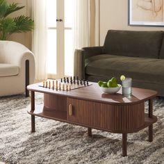 a living room scene with focus on the coffee table and chess set in the middle