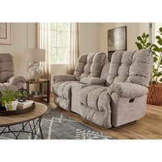 a living room with two recliners and a coffee table